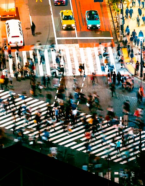 Shibuya crossing in Tokyo with pedestrians in motion